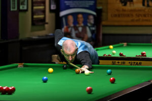Gary Taylor plays a snooker shot