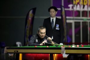 Numpol Thongpusawan plays a snooker shot