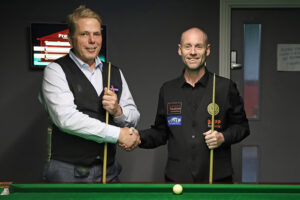 The two players shake hands
